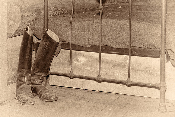 Boots and Iron Bed